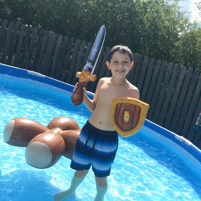 Customer photo: boy with Battle Float sword and shield